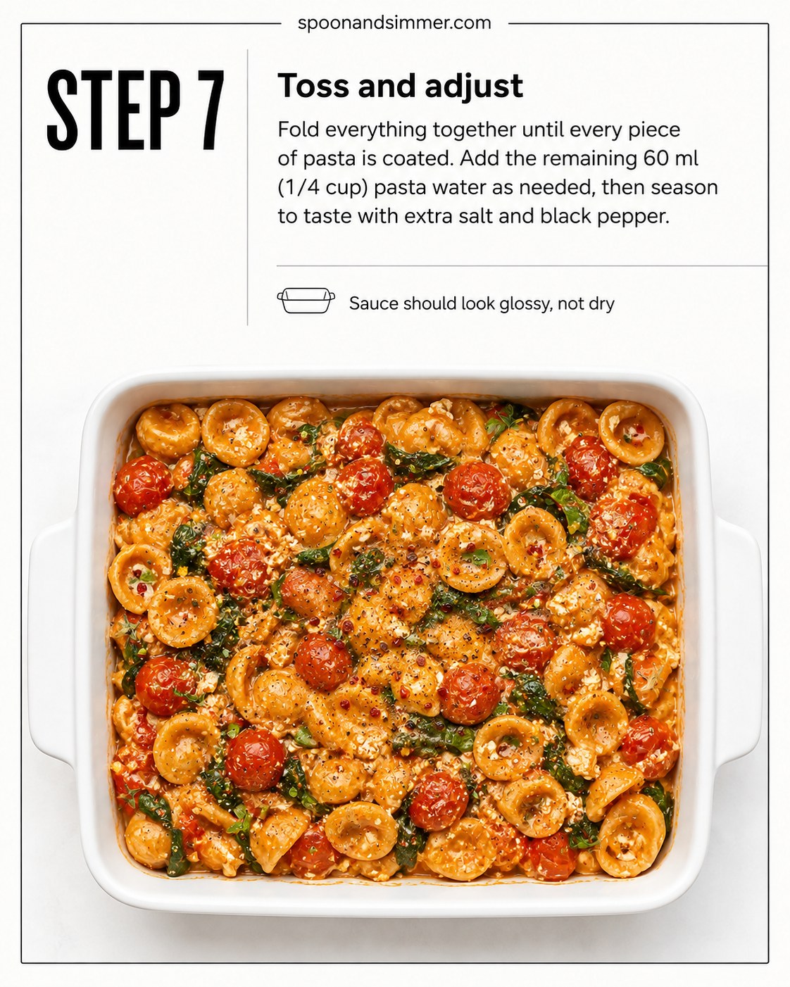 Baked feta pasta with spinach tossed together until glossy and evenly coated