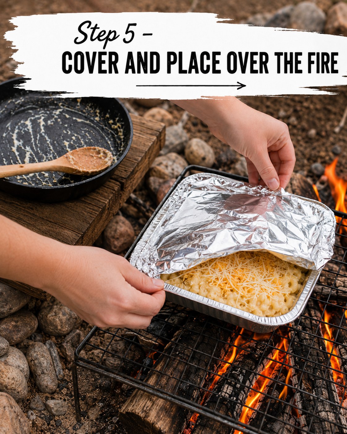 Covering the foil pan of campfire mac and cheese before setting it on the grate over flames