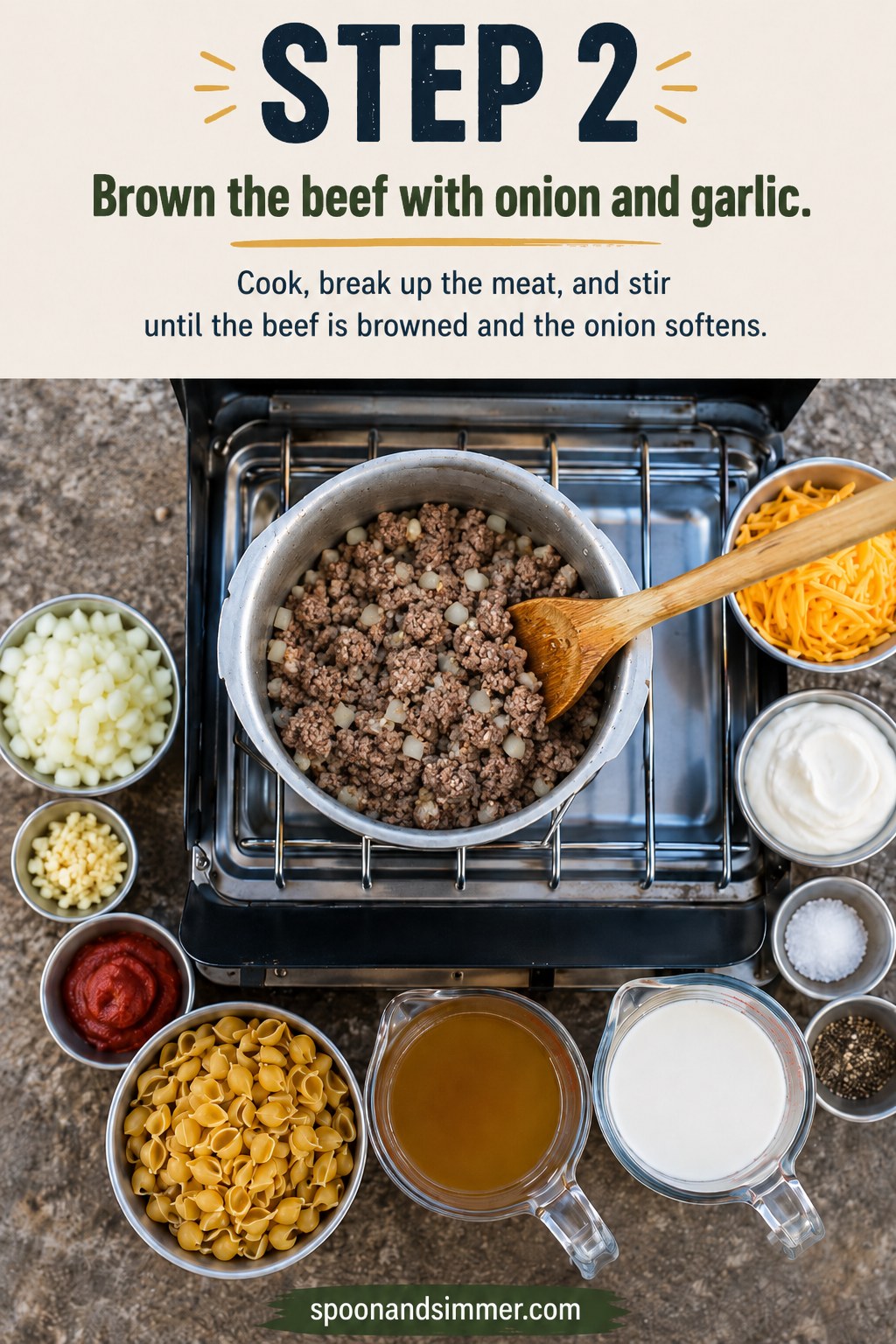 Ground beef browning with onion and garlic in a camp pot for one pot camping hamburger helper