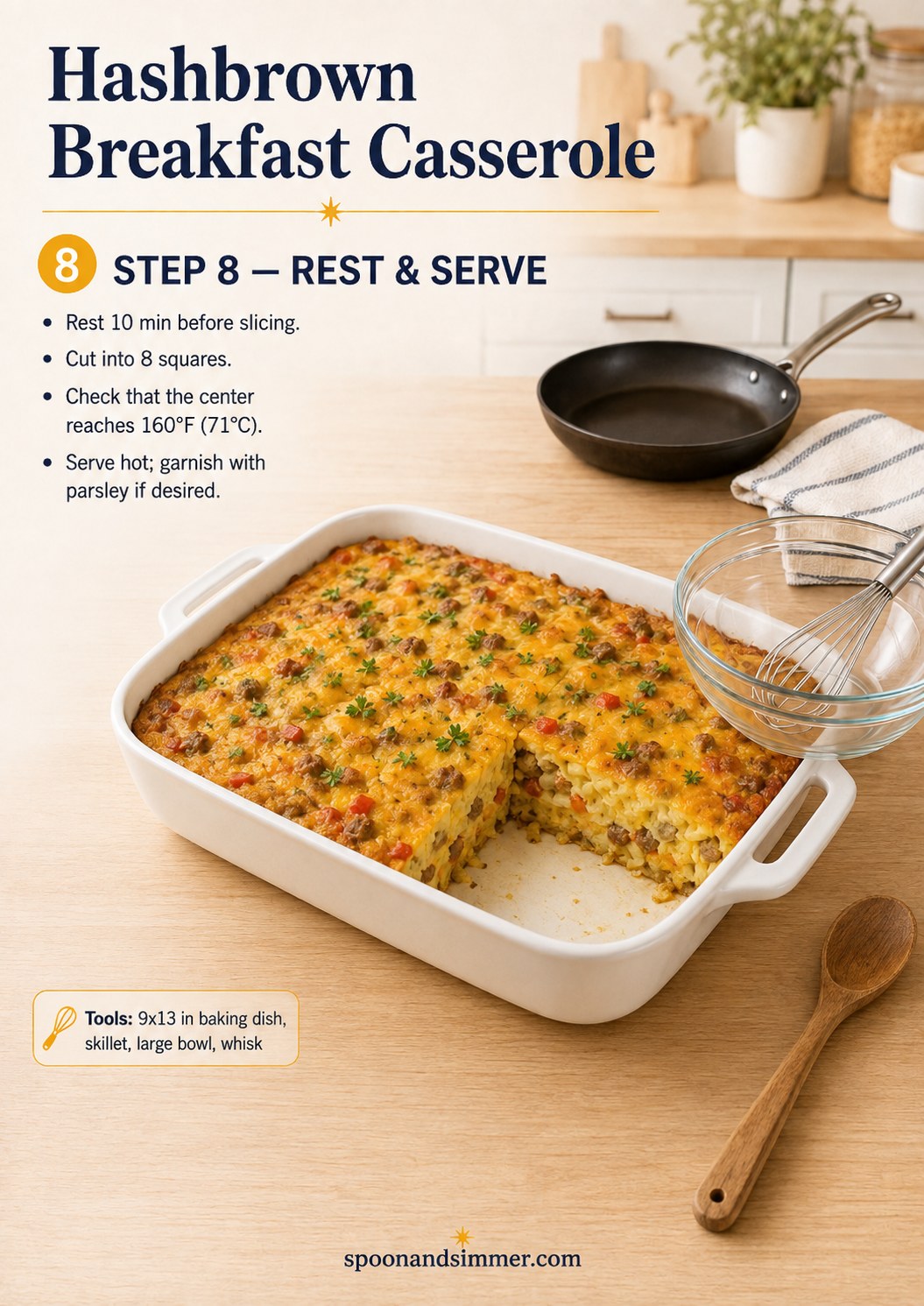 Sliced sausage hashbrown breakfast casserole resting in the dish with one square lifted out